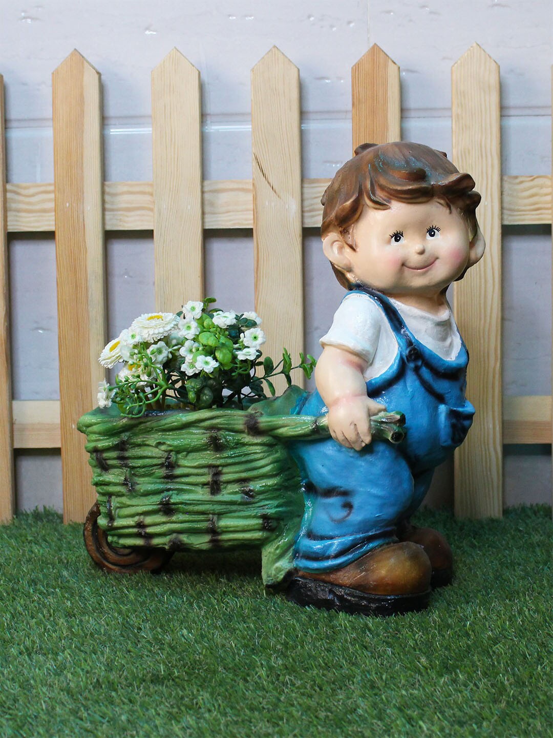 

Wonderland Blue & Green Boy Pushing Trolley Planter