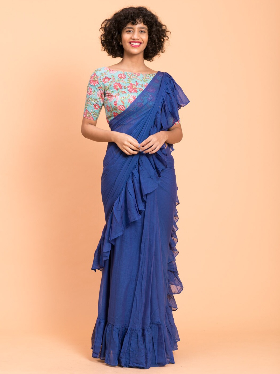

Suta Blue Solid Pure Cotton Ruffle Saree