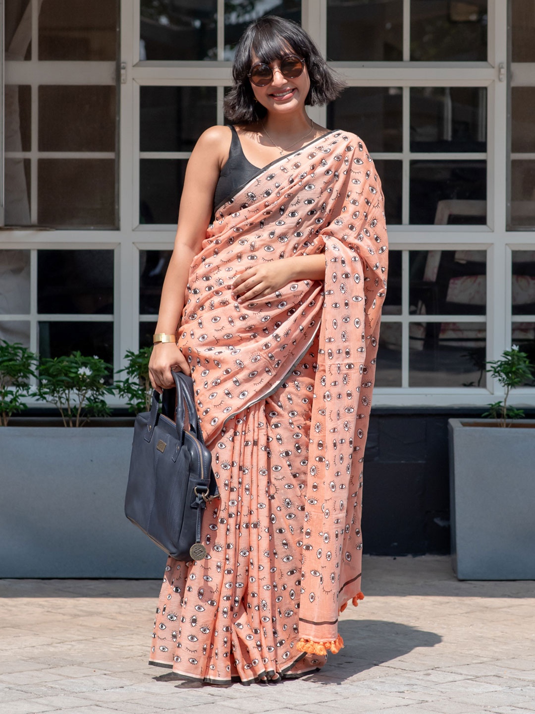 

Suta Orange-Coloured Black Printed Pure Cotton Saree