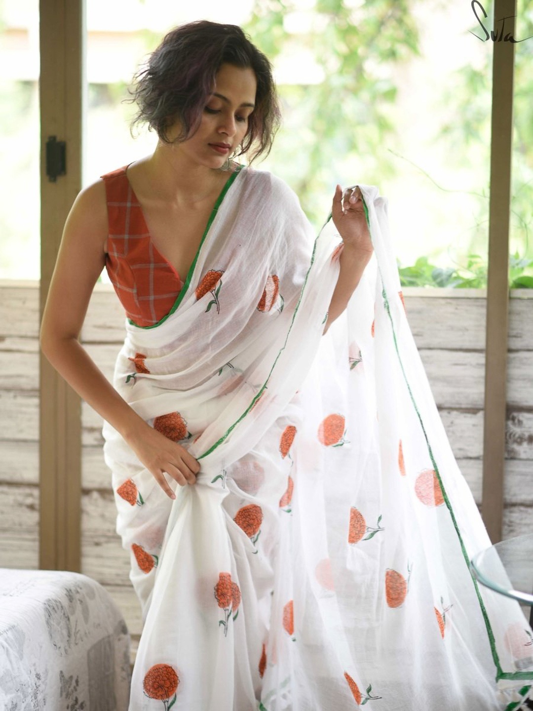 

Suta White & Orange Floral Pure Cotton Saree