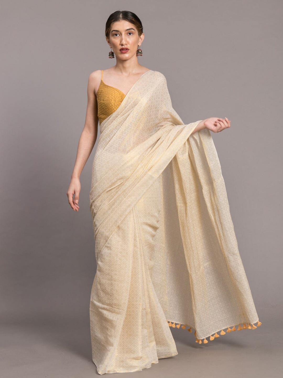 

Suta White & Gold-Toned Ethnic Motifs Zari Saree