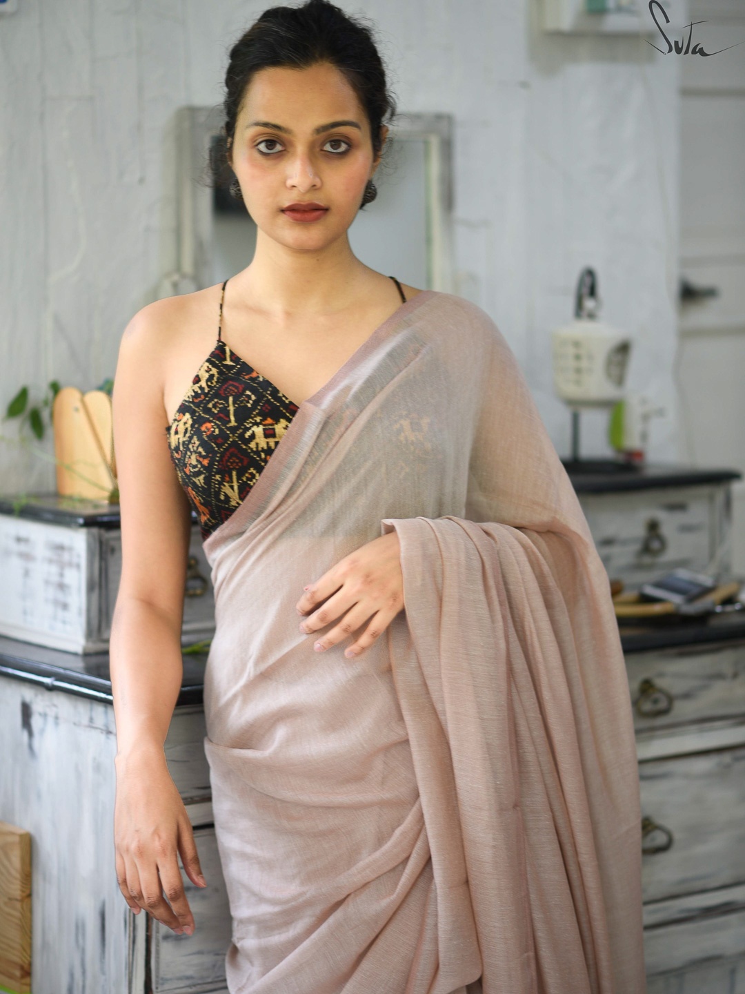 

Suta Beige Solid Cotton Blend Saree