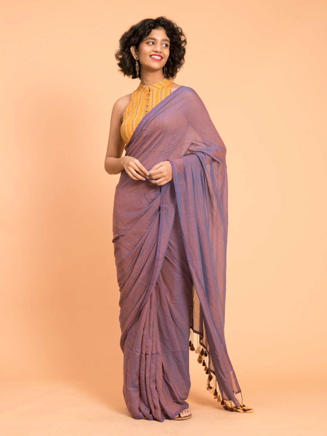 

Suta Lavender Solid Cotton Blend Saree