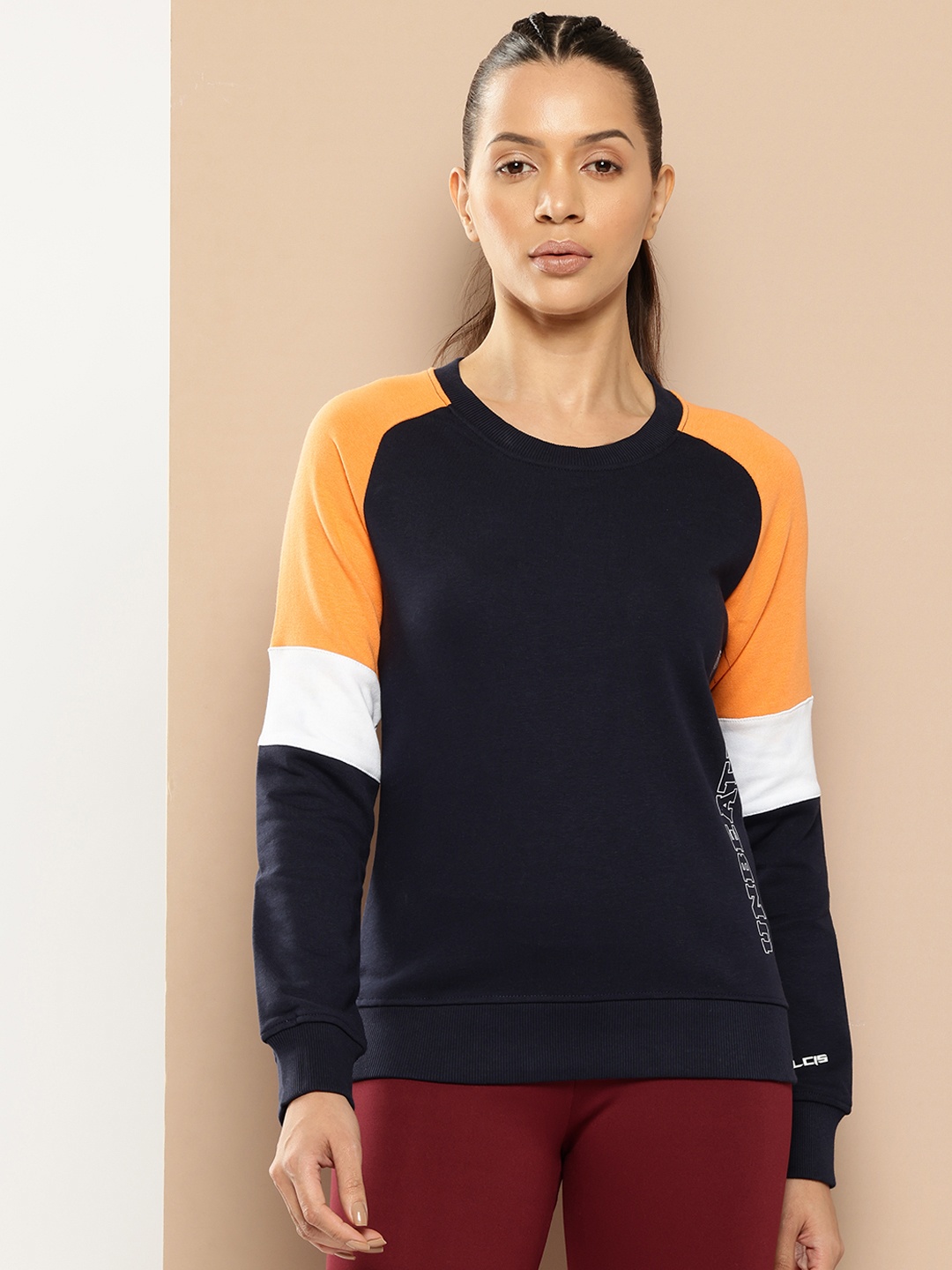 

Alcis Women Navy Blue & Orange Colourblocked Cotton Sweatshirt with Side Applique Prints