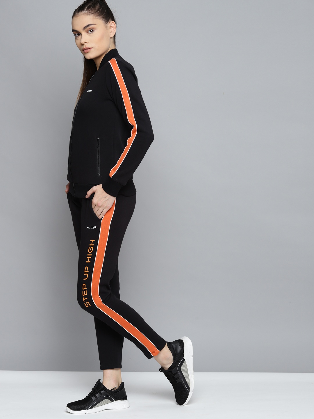 

Alcis Women Black & Orange Colourblocked Tracksuits