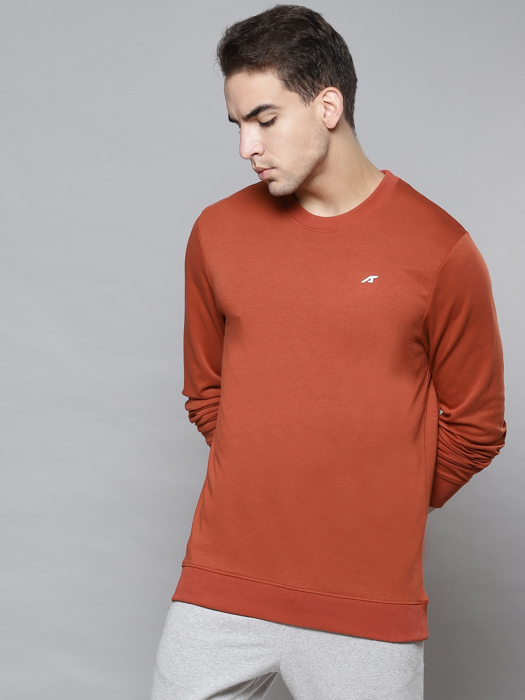 

Alcis Men Rust Orange Solid Round Neck Sweatshirt