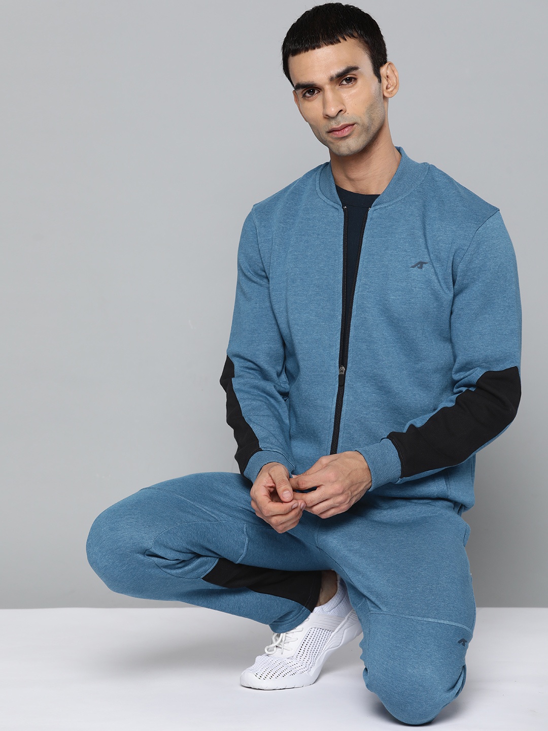 

Alcis Men Blue & Black Solid Track Suits