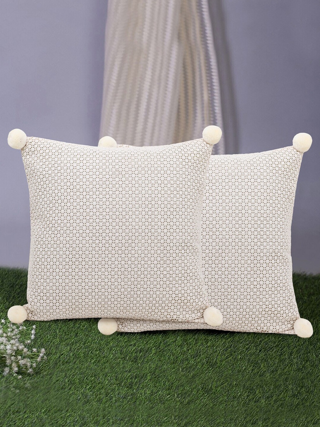 

Mezposh Off White Set of 2 Self Design Natural Cotton Square Cushion Covers with Pompoms