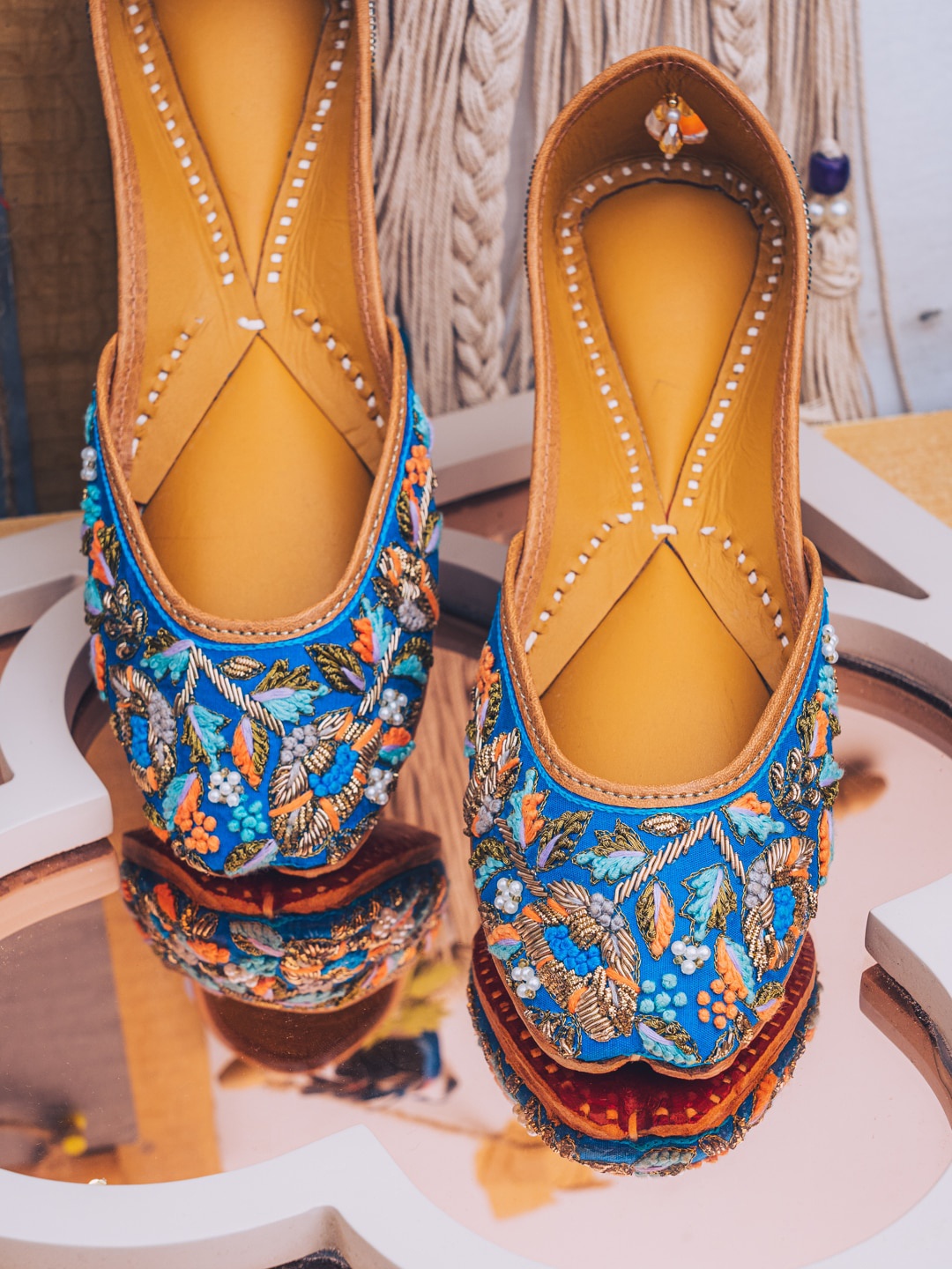 

NR By Nidhi Rathi Women Blue Hand Embroidered Leather Ethnic Mojaris Flats