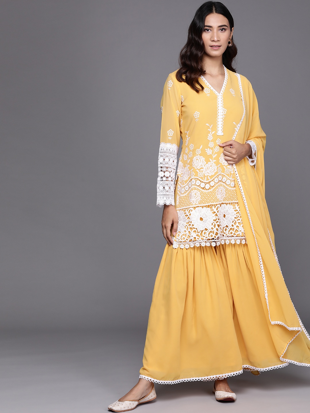 

Libas Women Yellow Floral Embroidered Regular Kurti with Sharara & Dupatta