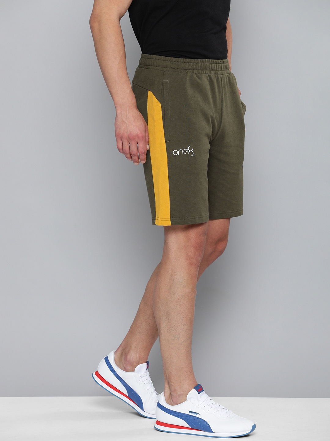 

one8 x PUMA Men Olive Green Solid Regular Shorts