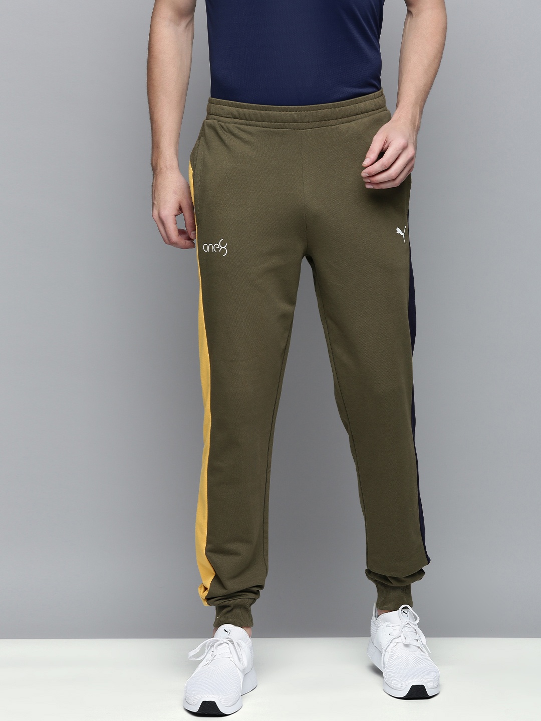 

one8 x PUMA Men Olive Green Solid Regular Fit VK Regular Joggers With Contrast Panels
