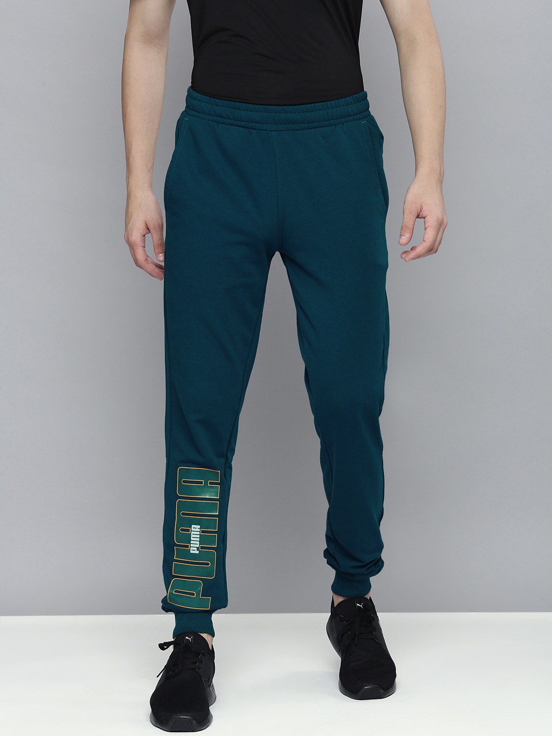 

Puma Men Teal Blue Printed Slim Fit Mid Rise Joggers