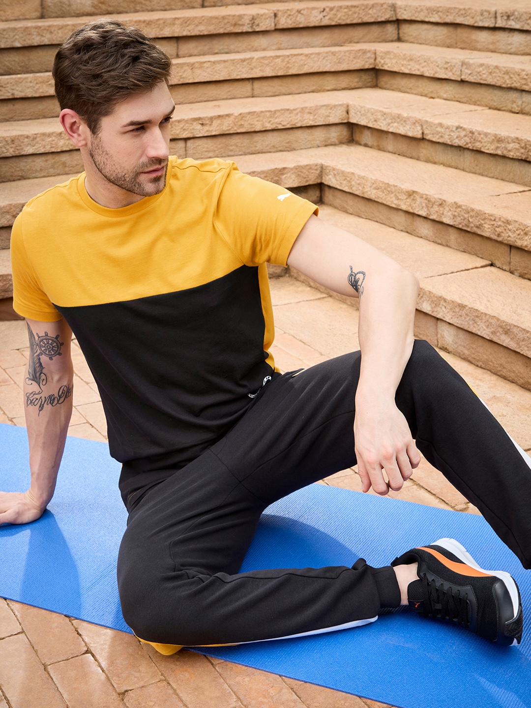 

one8 x PUMA Men Mustard Yellow & Black Colourblocked Slim Fit Cotton Casual T-shirt