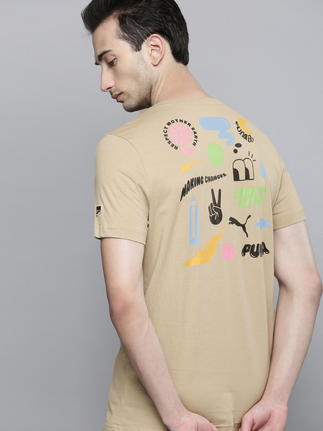 

Puma Men Beige Typography Printed Downtown GraphicPure Cotton Sustainable T-shirt