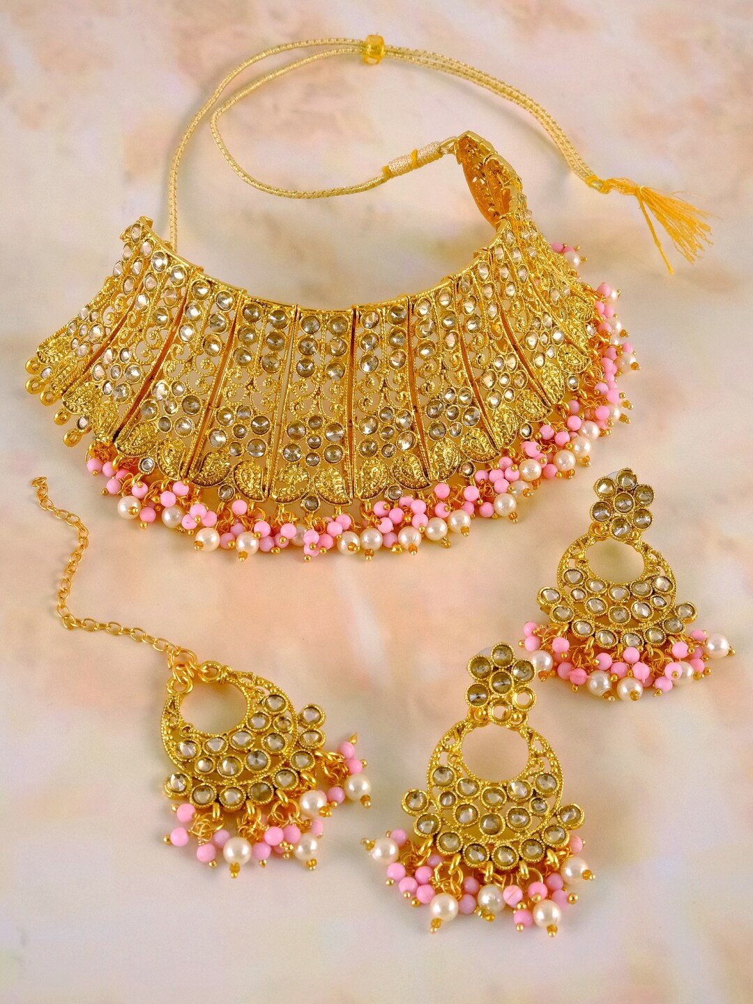 

Crunchy Fashion Gold Plated White Stone Studded Pink Beaded Jewellery Set