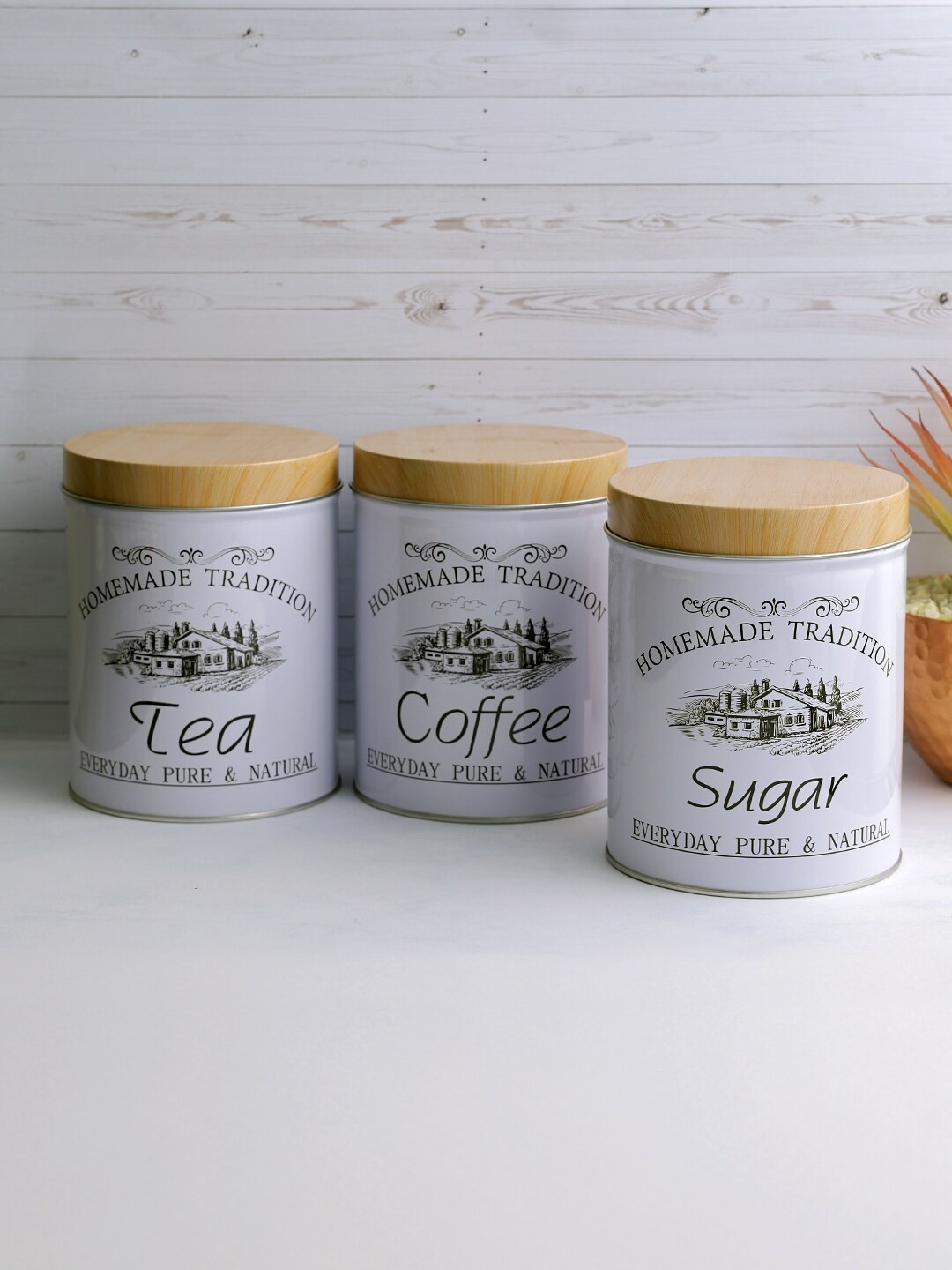 

A Vintage Affair- Home Decor Set Of 3 White & Brown Printed Metal Canisters