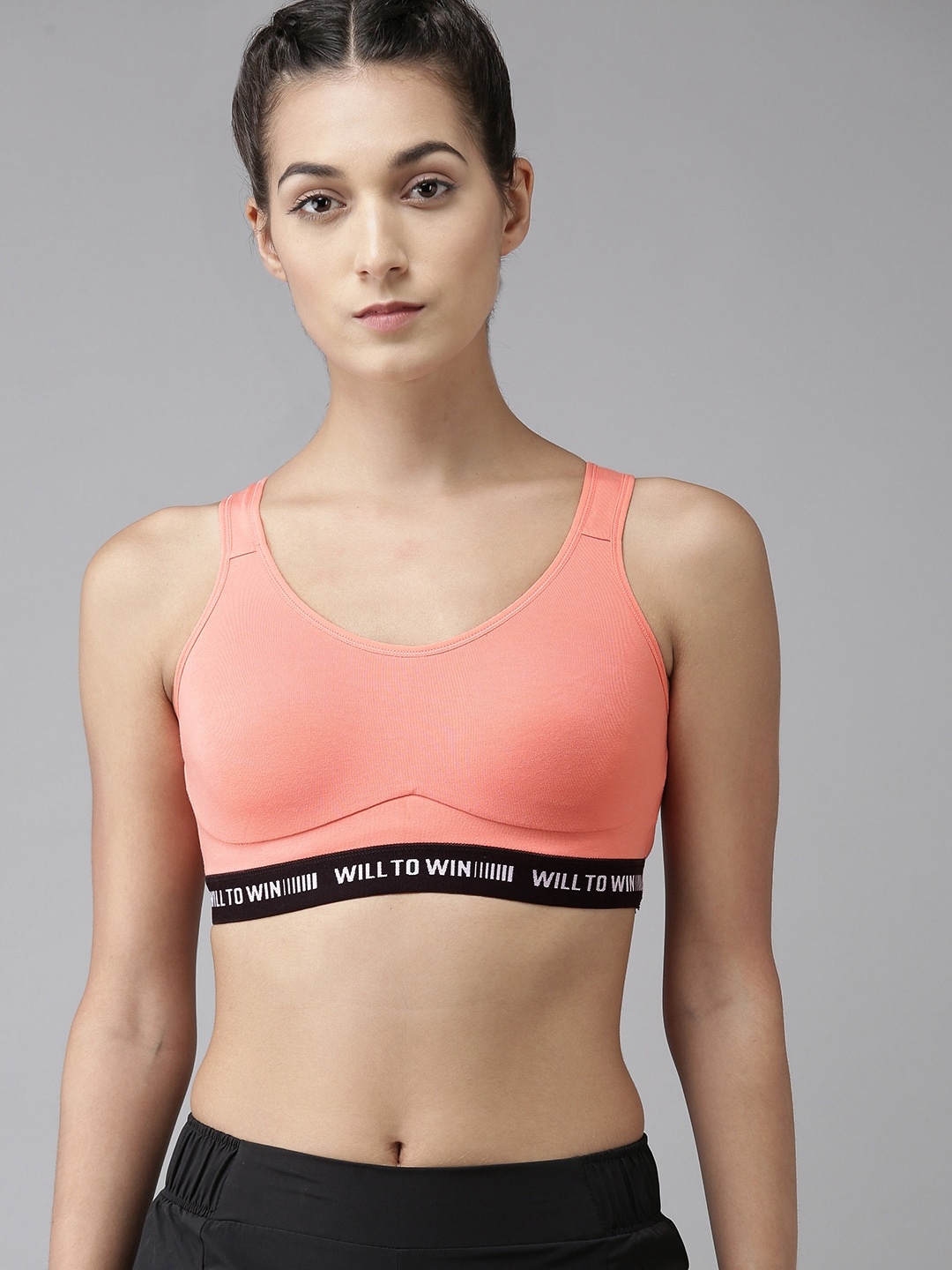 

Van Heusen Proactive Women Coral Solid Antibacterial Wireless Sports Bra ILIBR1AWSOP44006, Orange