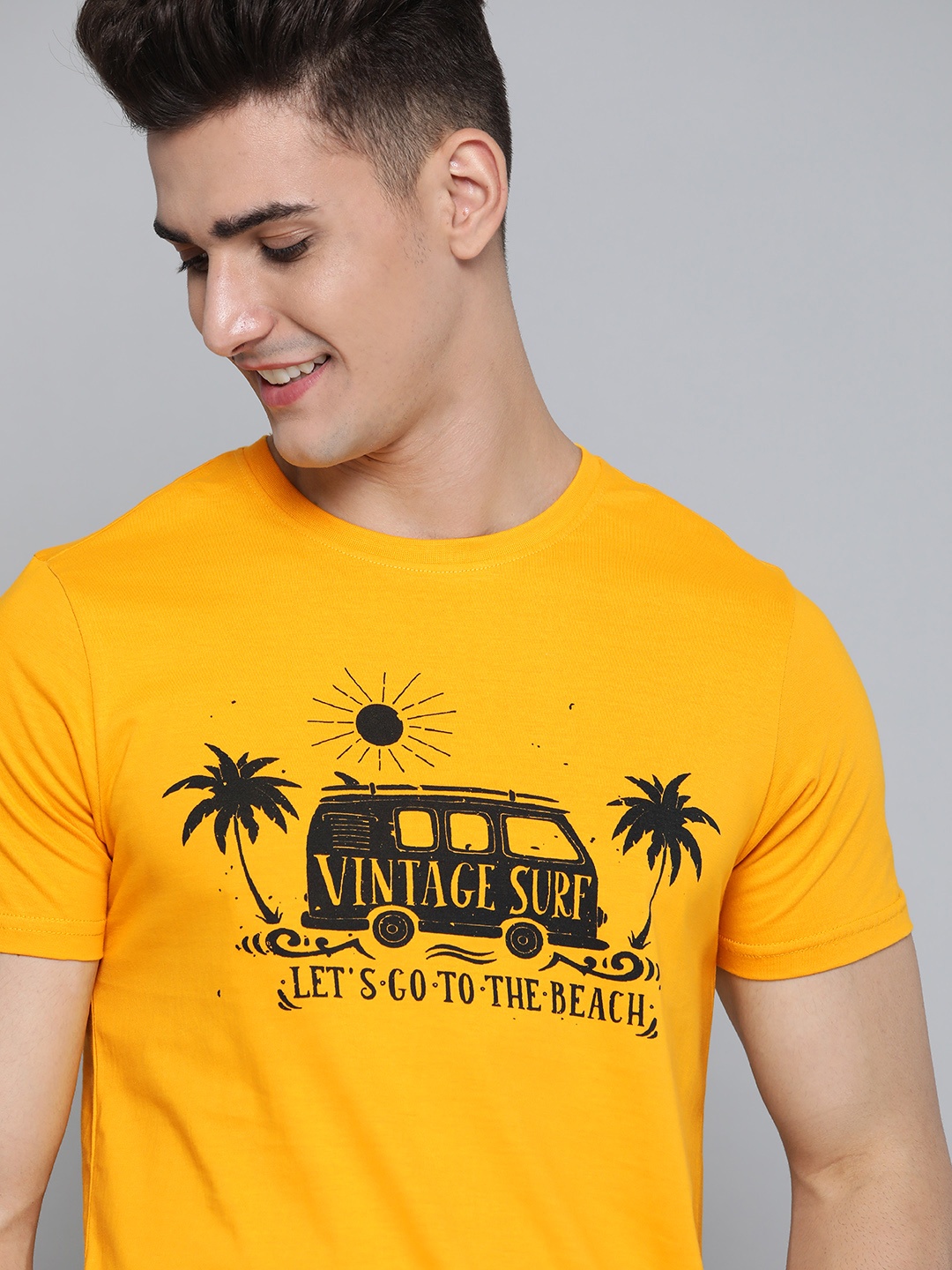 

Mast & Harbour Men Yellow & Black Pure Cotton Printed Tropical T-shirt