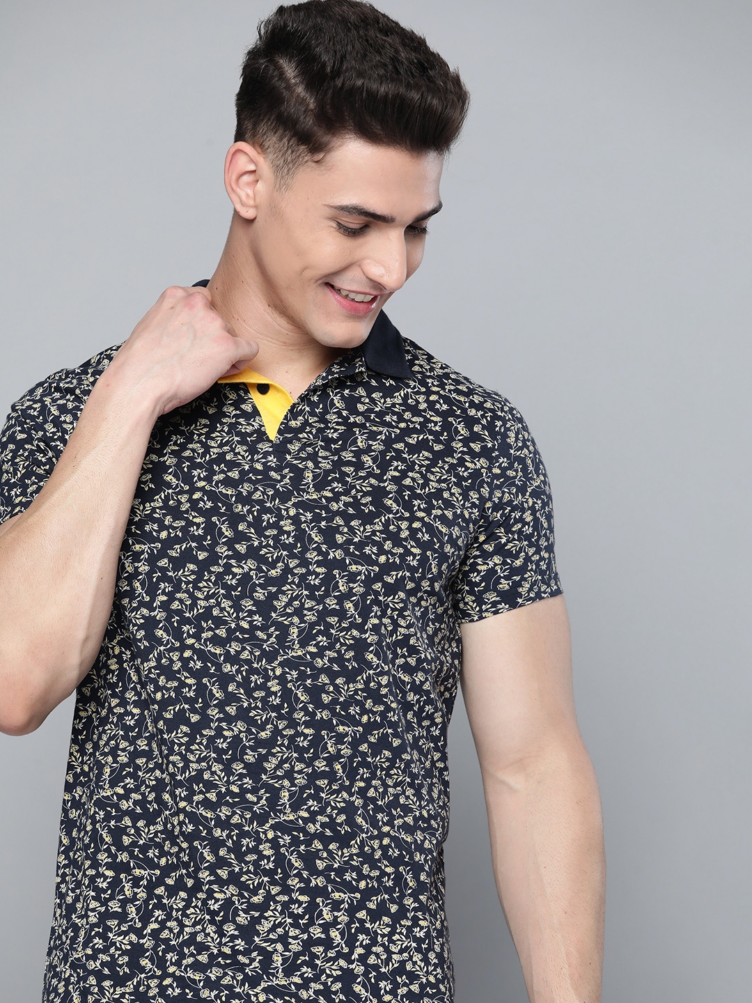 

Mast & Harbour Men Navy Blue & White Ditsy Floral Print Pure Cotton Polo Collar T-shirt