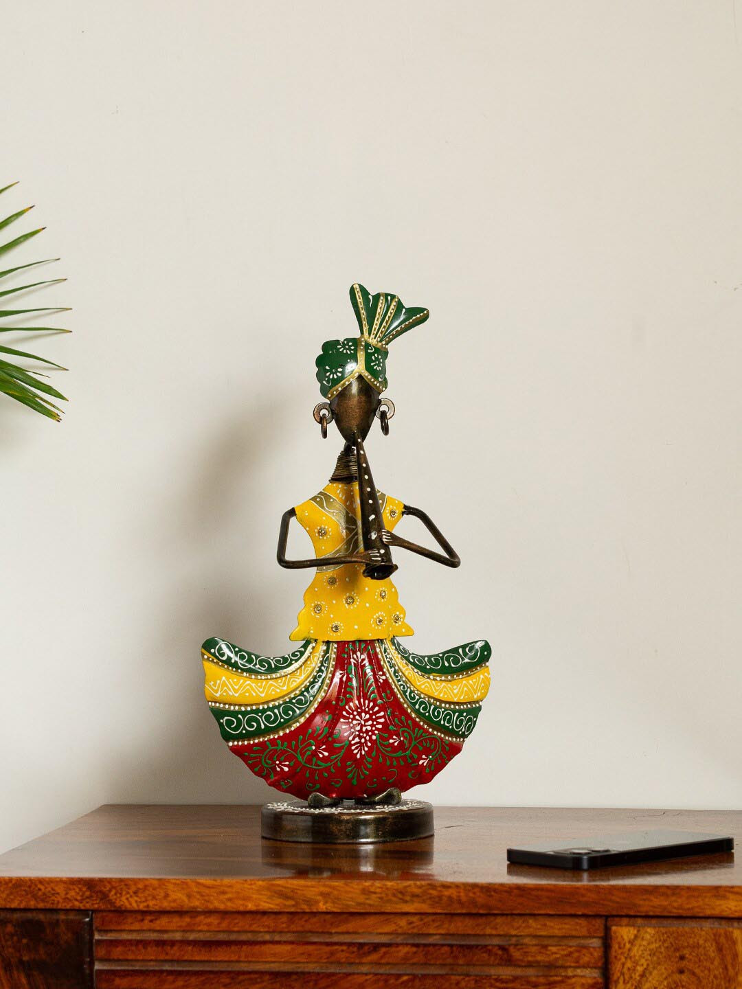 

ExclusiveLane Red Handpainted & Handcrafted Decorative Bansuriwala Folk Artist Showpiece