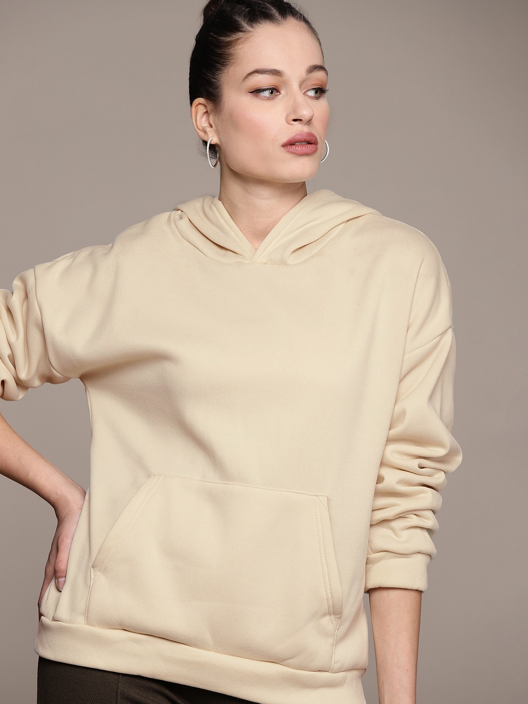 

URBANIC Women Beige Solid Hooded Sweatshirt