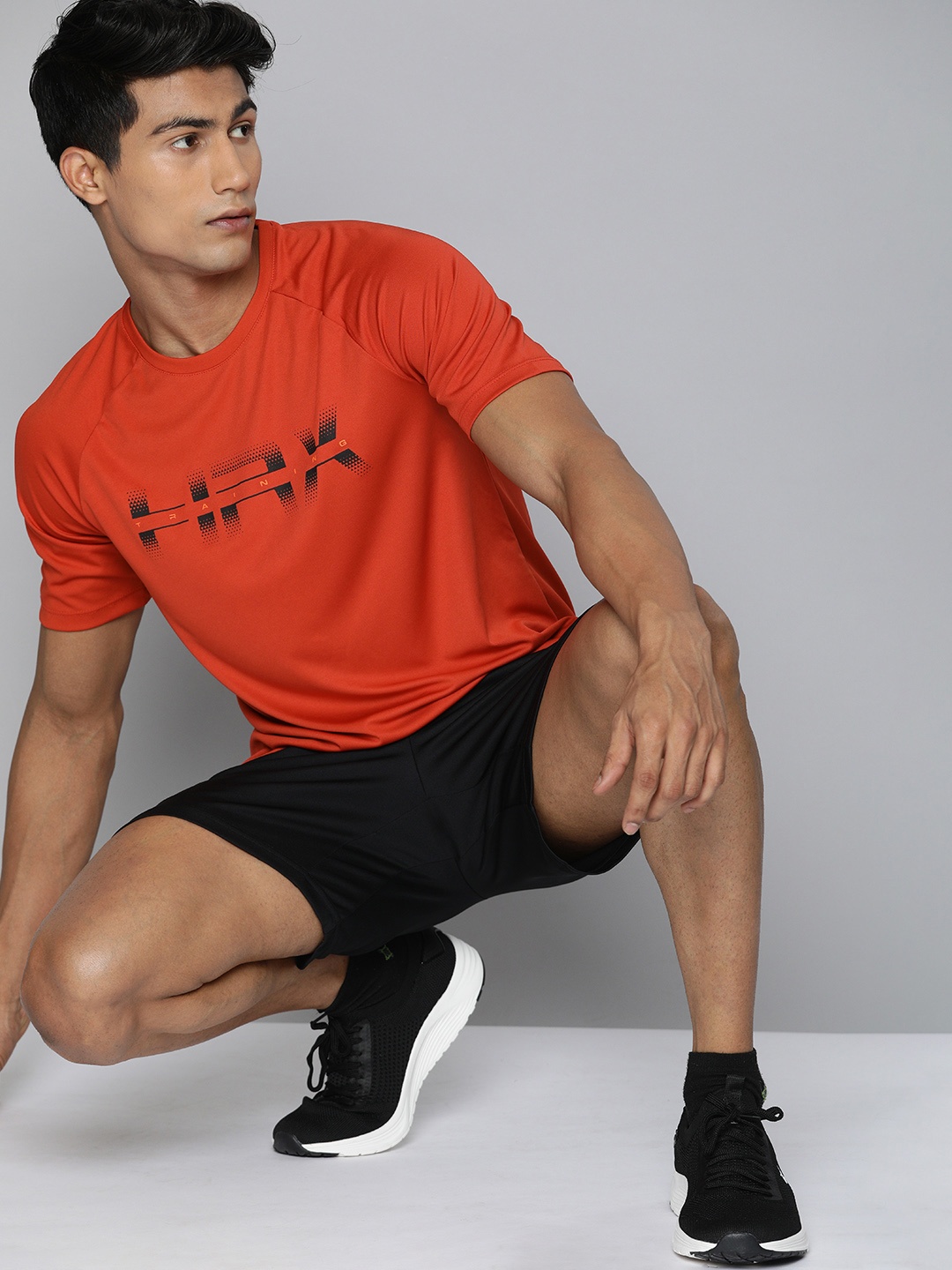 

HRX By Hrithik Roshan Men Red & Black Rapid-Dry Brand Carrier Training Tshirts