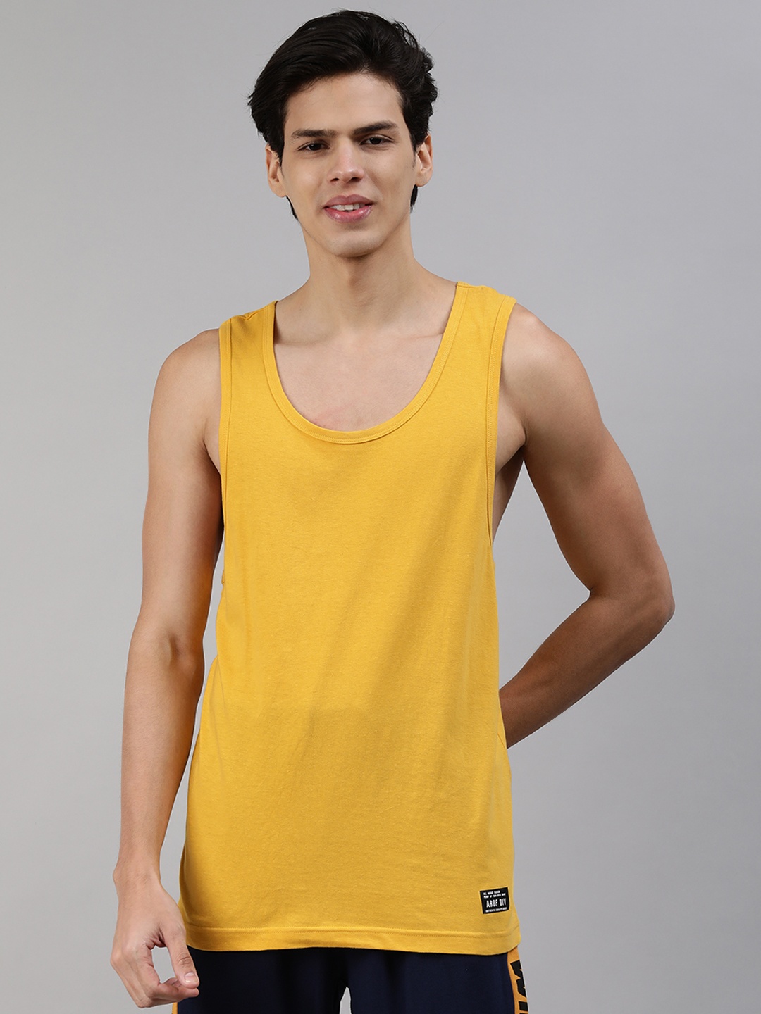 

abof Men Mustard Yellow Solid Sleeveless Pure Cotton T-shirt