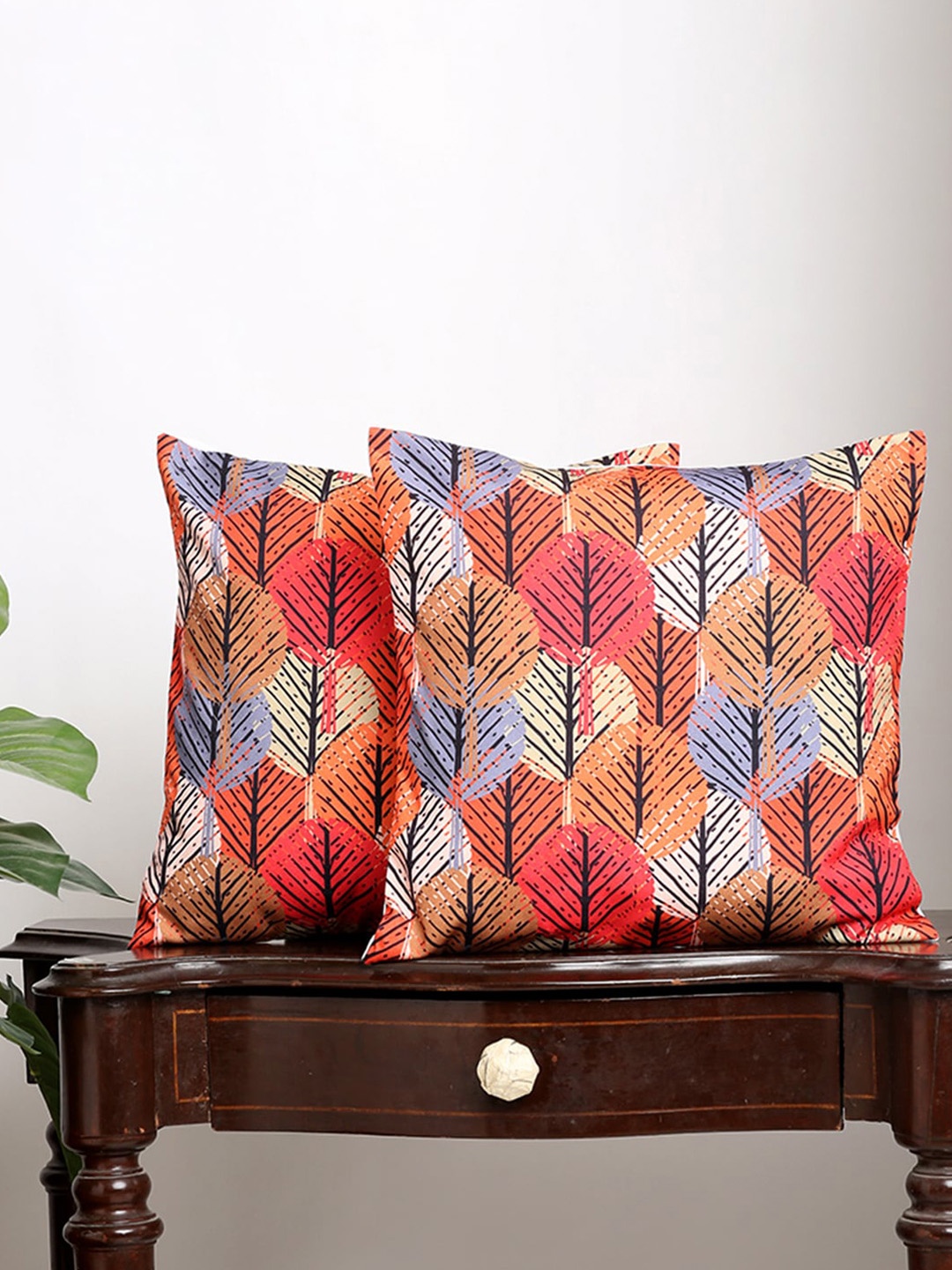 

Alina decor Set Of 2 Red & Yellow Ethnic Motifs Square Cushion Covers