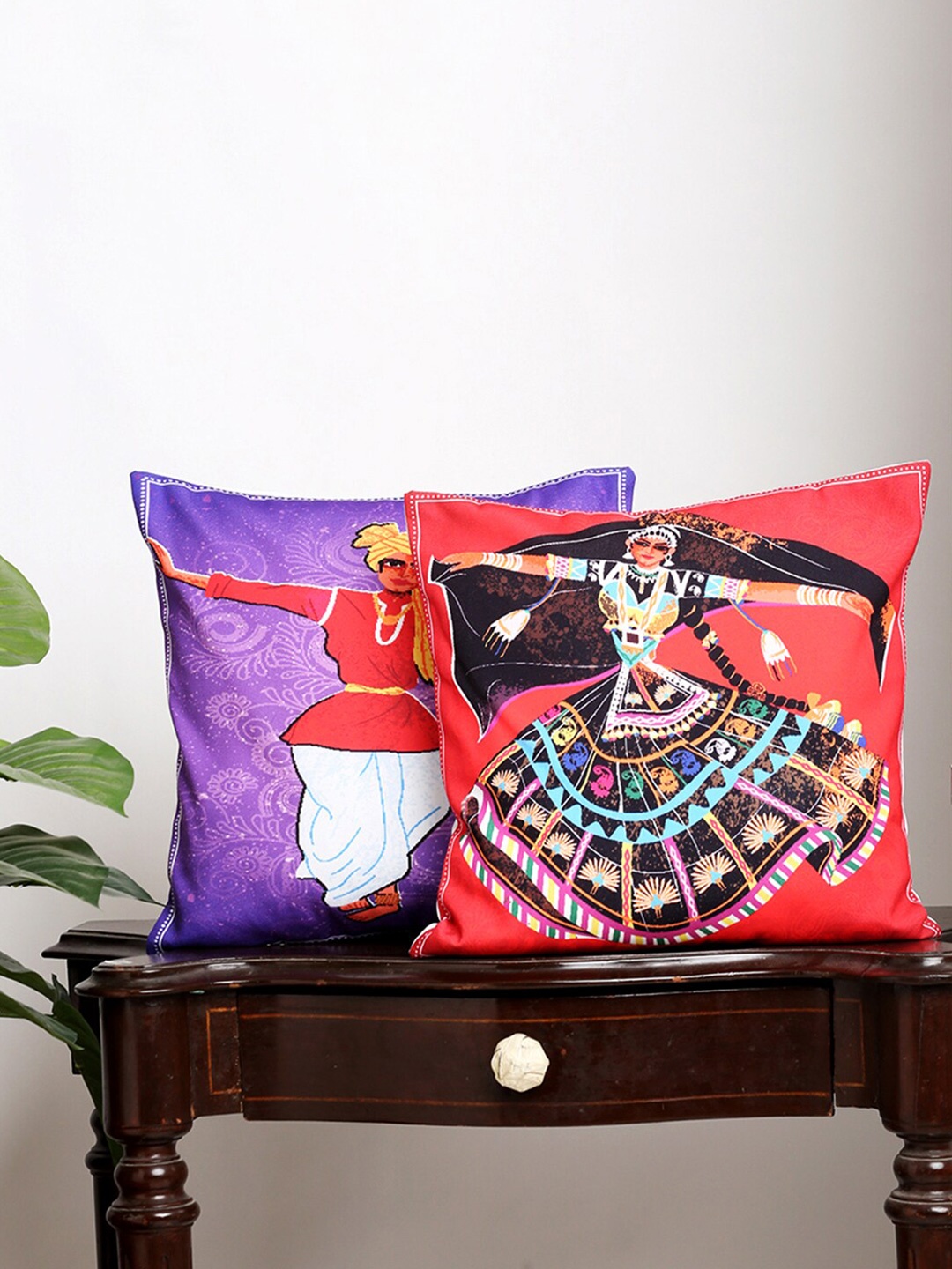 

Alina decor Set Of 2 Red & Purple Ethnic Motifs Square Cushion Covers