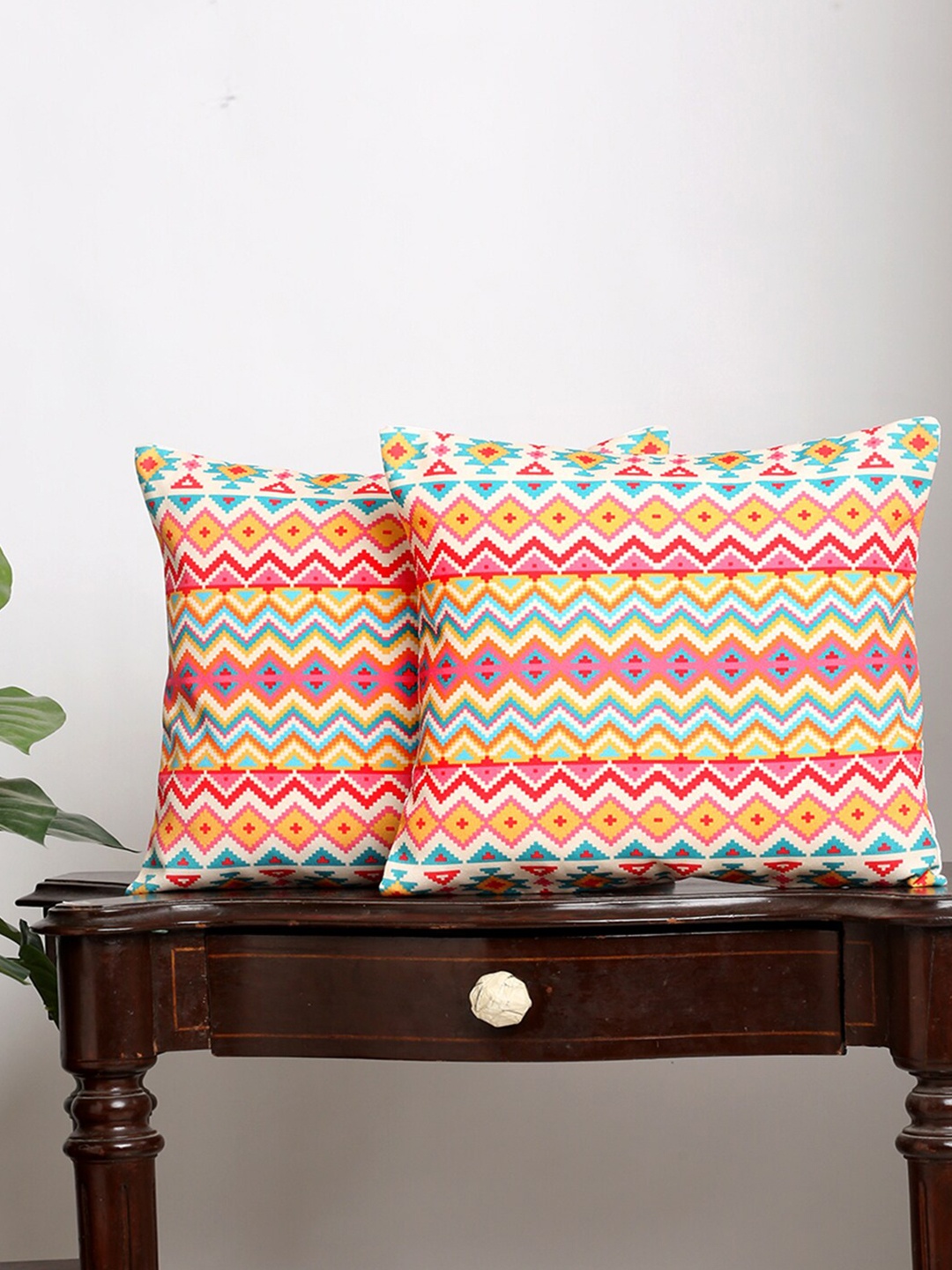 

Alina decor Set Of 2 Red & Yellow Ethnic Motifs Square Cushion Covers