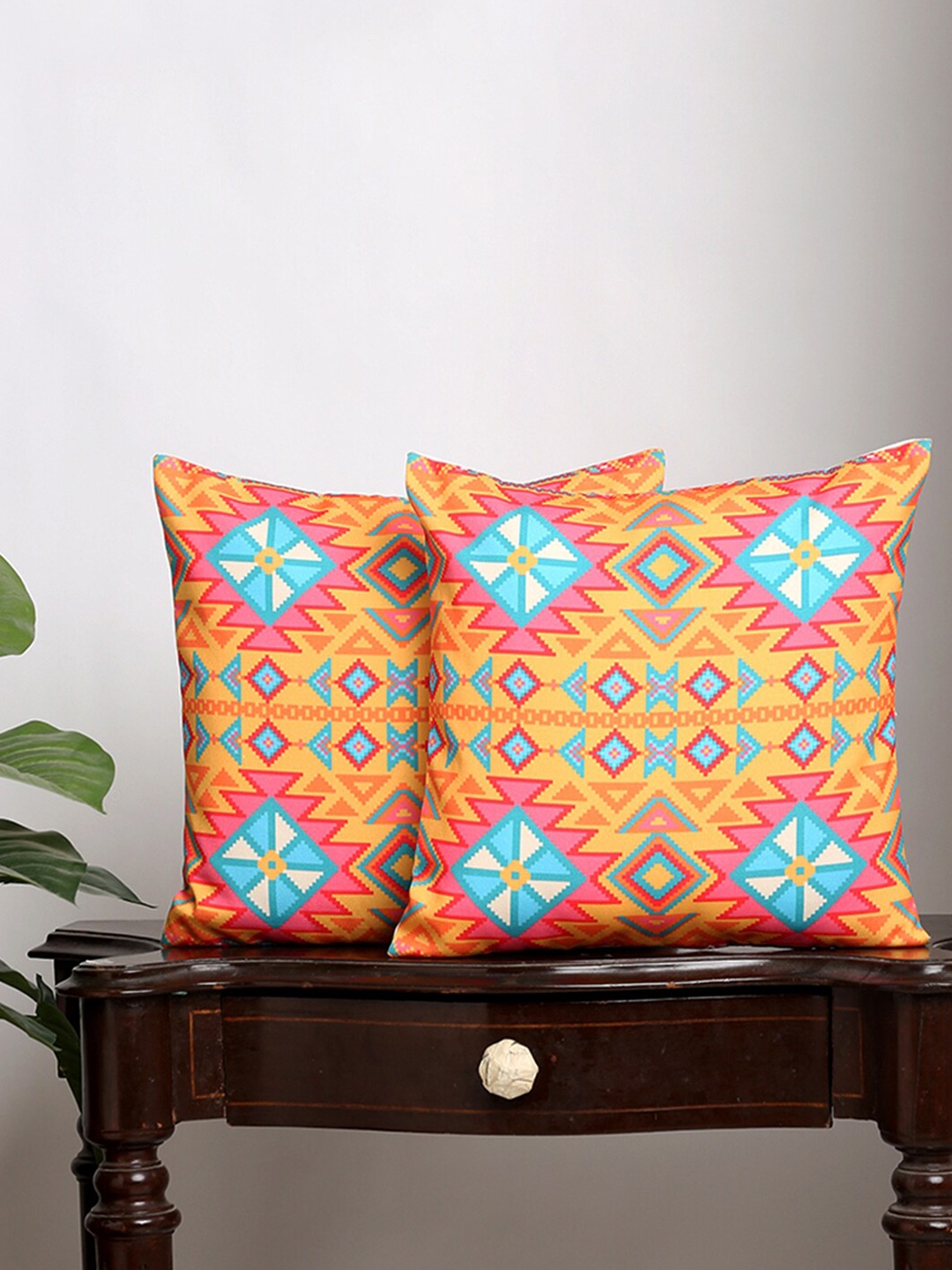 

Alina decor Set Of 2 Yellow & Red Ethnic Motifs Square Cushion Covers