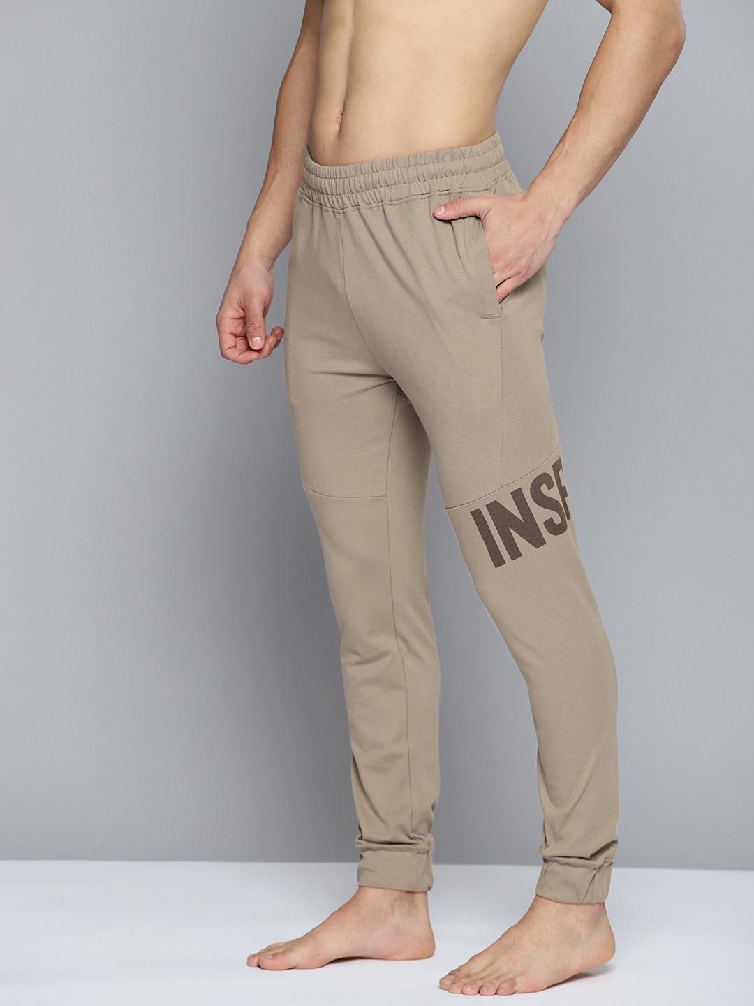 

HRX By Hrithik Roshan Yoga Men Brindle Rapid-Dry Typography Sustainable Track Pants, Khaki