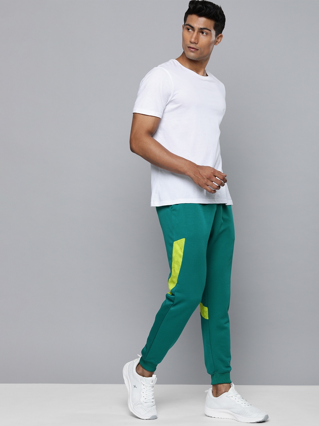 

HRX By Hrithik Roshan Men Teal Green Slim Fit Striped Rapid-Dry Training Joggers