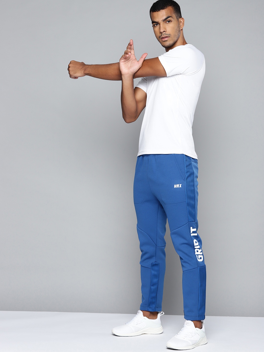 

HRX By Hrithik Roshan Training Men Blue Printed Slim Fit Rapid Dry Training Track Pants