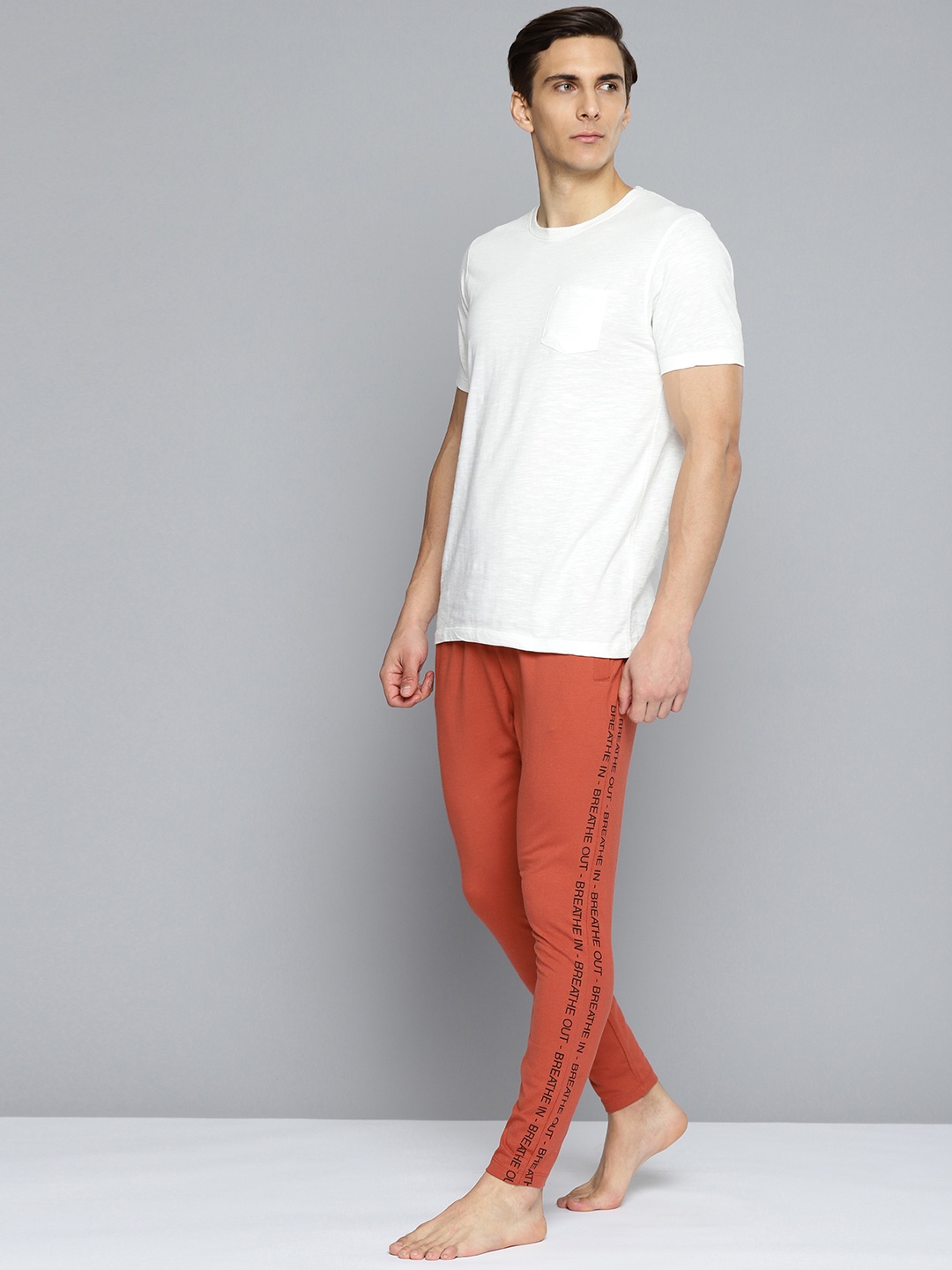 

HRX By Hrithik Roshan Yoga Men Tandoori Spice Rapid-Dry Solid Sustainable Track Pants, Rust