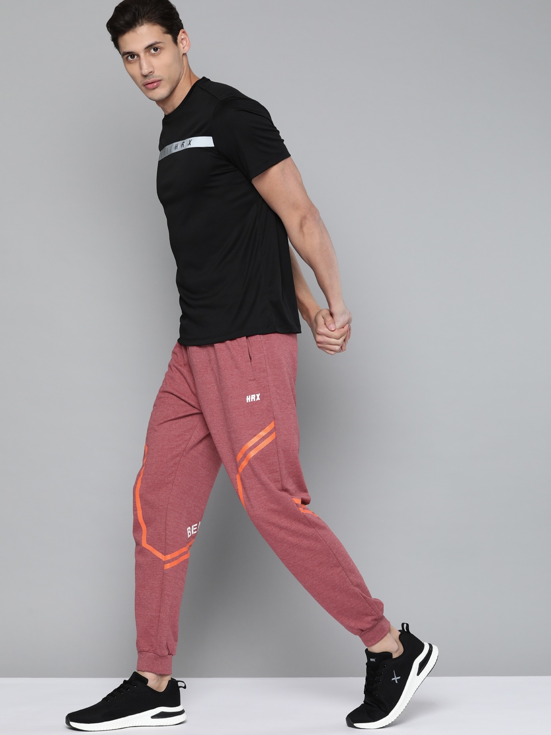 

HRX By Hrithik Roshan Training Men Red Melange Rapid-Dry Solid Track Pant, Rust
