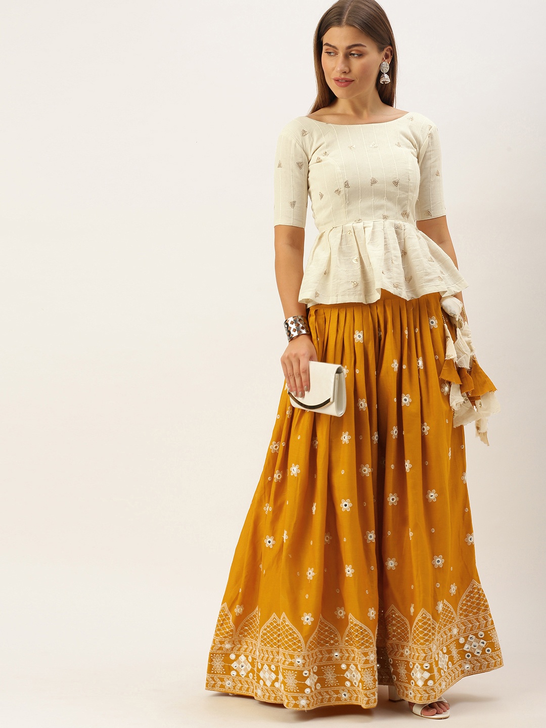 

LOOKNBOOK ART Mustard & Off White Semi-Stitched Lehenga & Unstitched