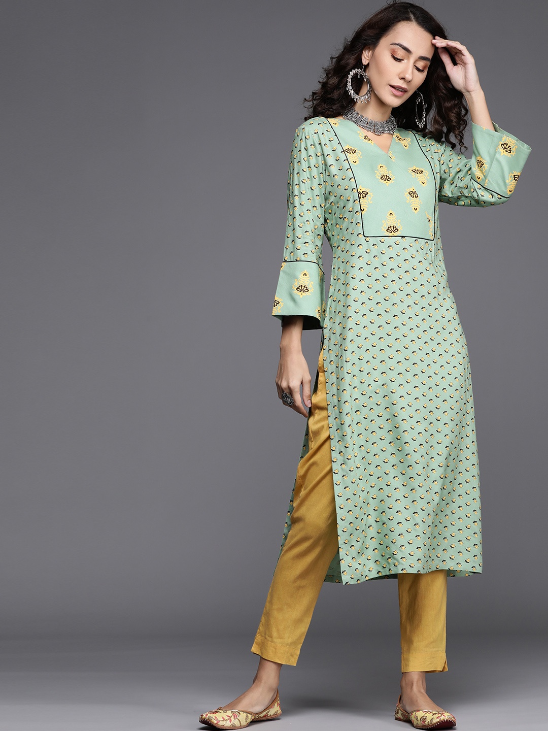 

Libas Women Green & Yellow Floral Printed Flared Sleeves Yoke Design Pastels Kurta