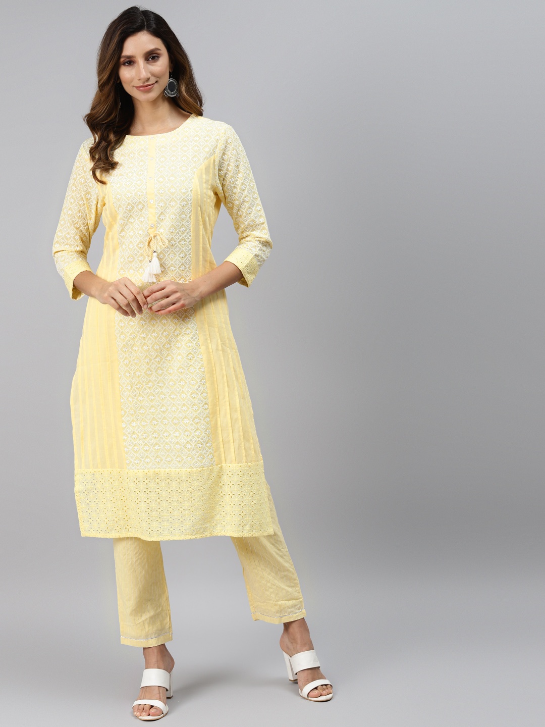 

Readiprint Fashions Women Yellow & White Motifs Embroidered Kurta with Trousers