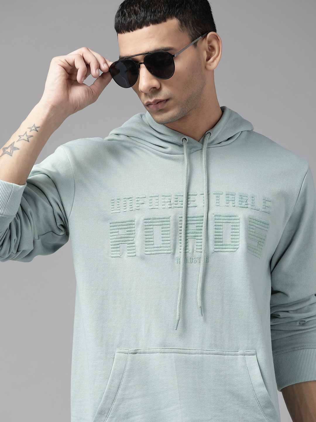 

The Roadster Lifestyle Co. Men Blue Typographic Embroidered Hooded Sweatshirt