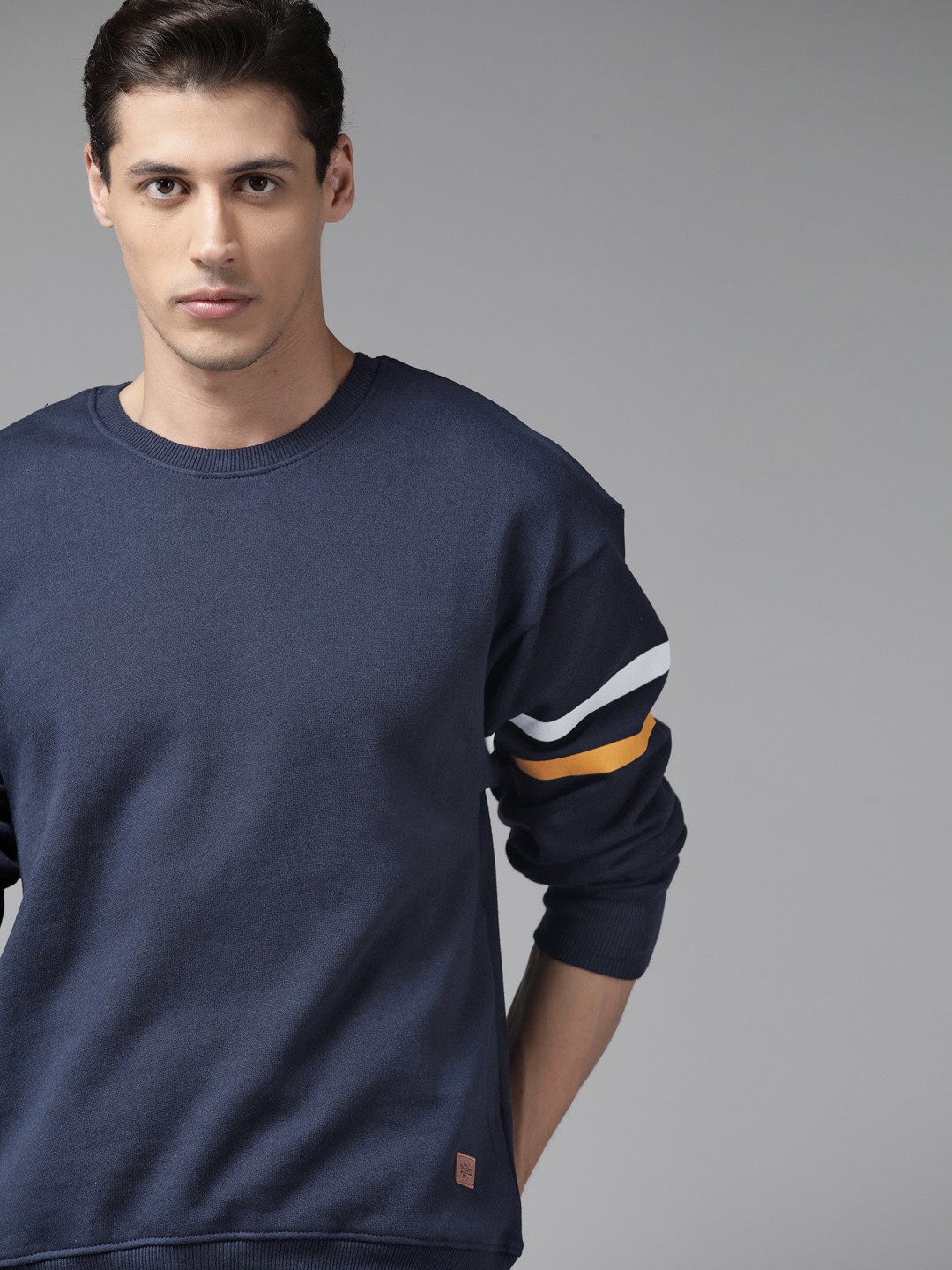 

Roadster Men Navy Blue Solid Sweatshirt with Striped Sleeves