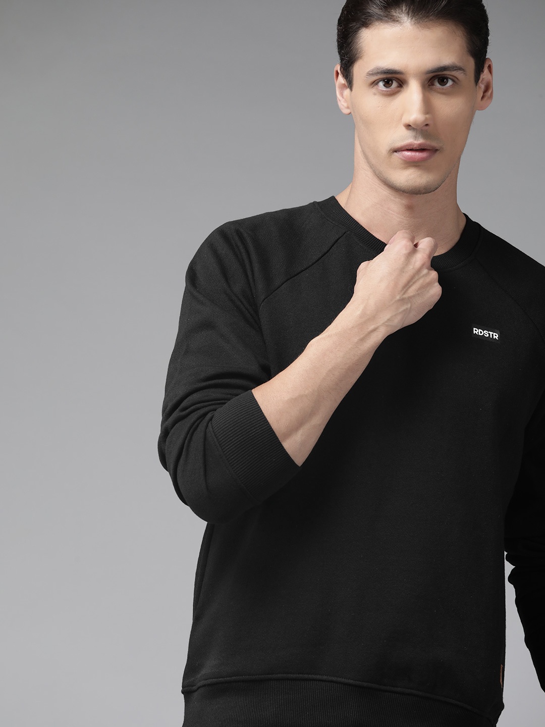 

Roadster Men Black Solid Sweatshirt