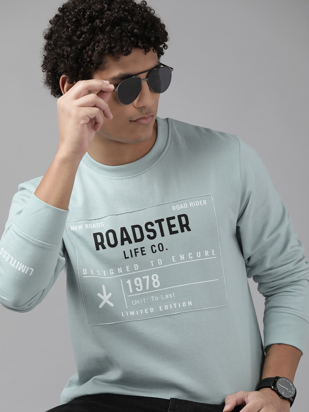 

The Roadster Lifestyle Co. Men Blue Brand Logo Printed Sweatshirt