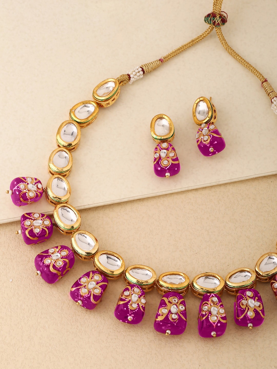 

Shoshaa Gold-Plated White Stone-Studded Magenta Pink Beaded Handcrafted Jewellery Set