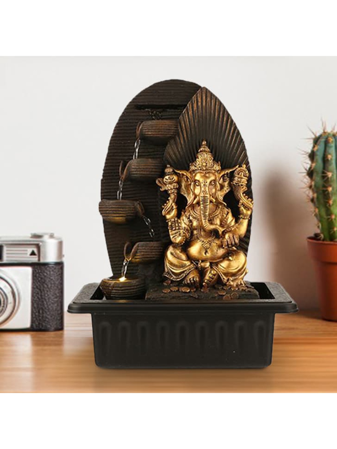 

Living Essence Brown & Gold Polyresin Small Ganesh Ray Pot Showpiece