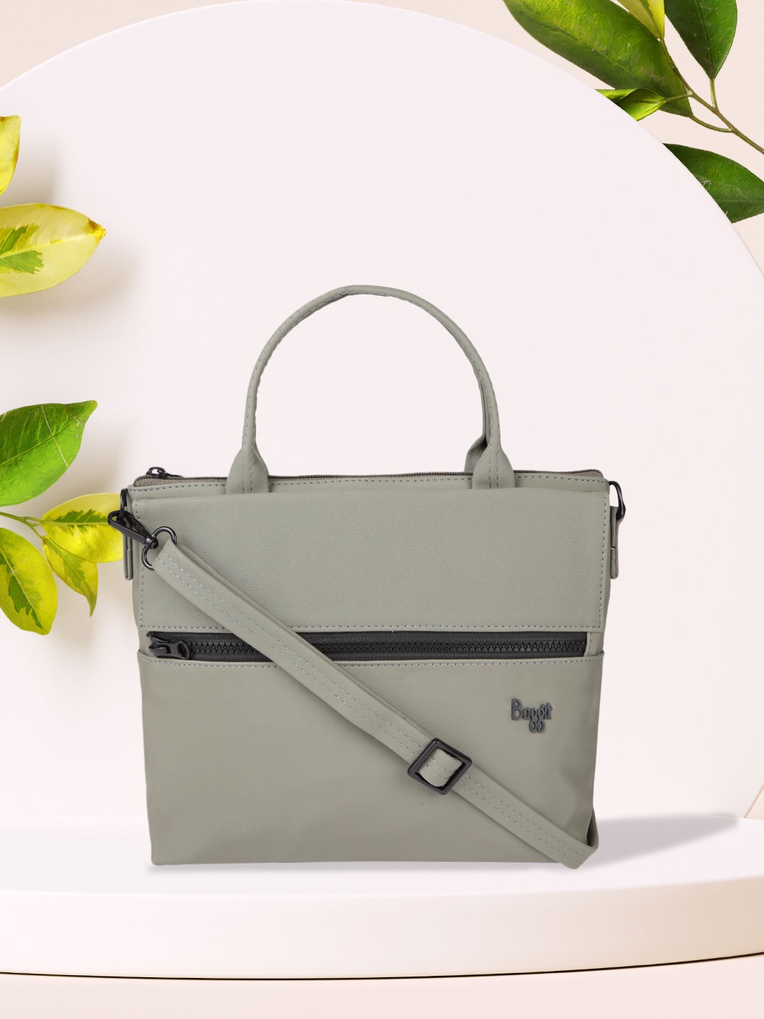 

Baggit Green Solid Synthetic Leather Regular Structured Handheld Bag