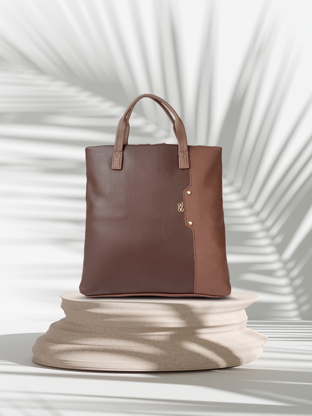 

Baggit Brown Textured Handheld Bag Cum Backpack