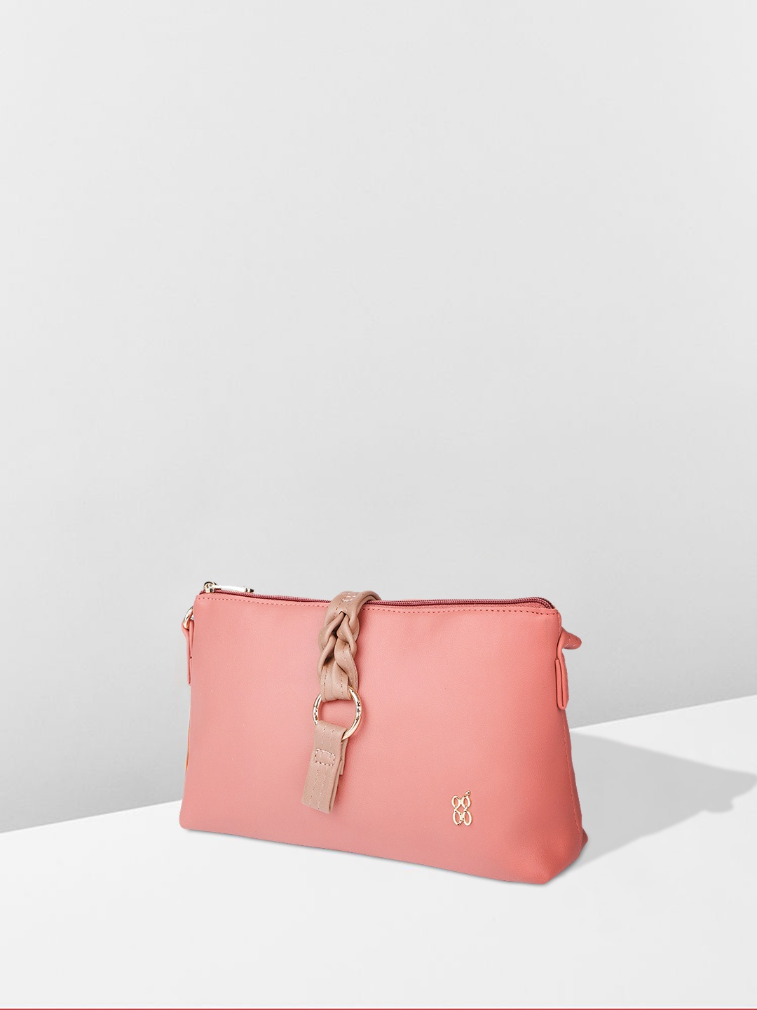 

Baggit Pink Solid Synthetic Leather Regular Structured Sling Bag with Buckle Detail