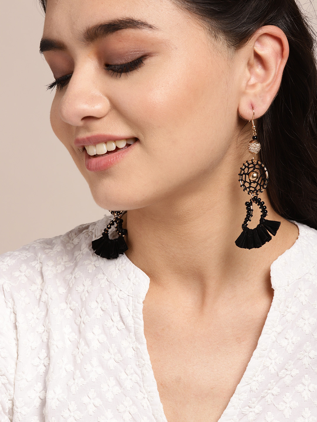 

Sangria Black Rose Gold-Plated Stone Studded Tasselled Contemporary Drop Earrings